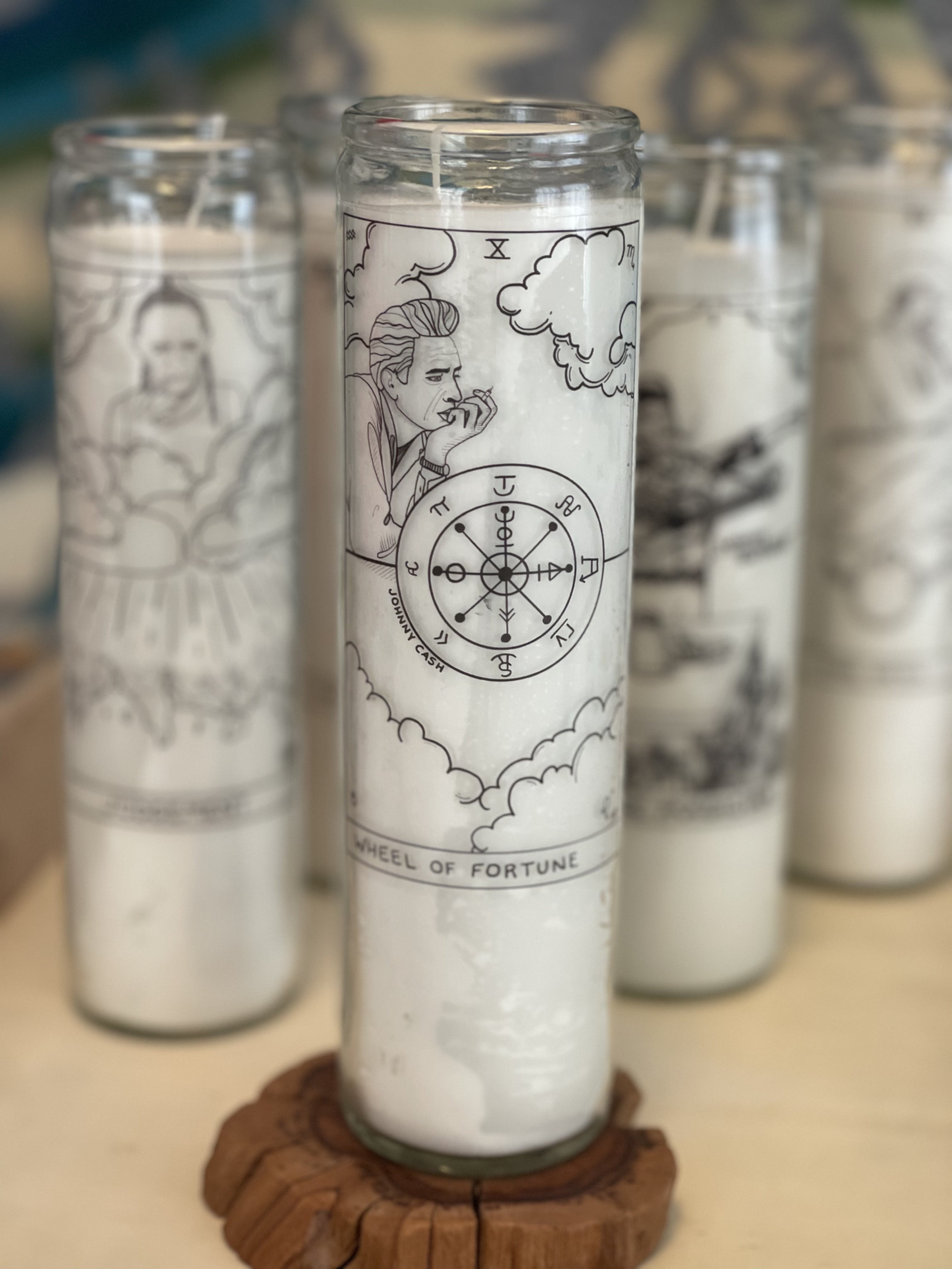 Johnny Cash Wheel of Fortune Prayer Candle with Black and White Folk Art Illustration from The Outlaw Oracle's Honky Tonk Tarot Collection