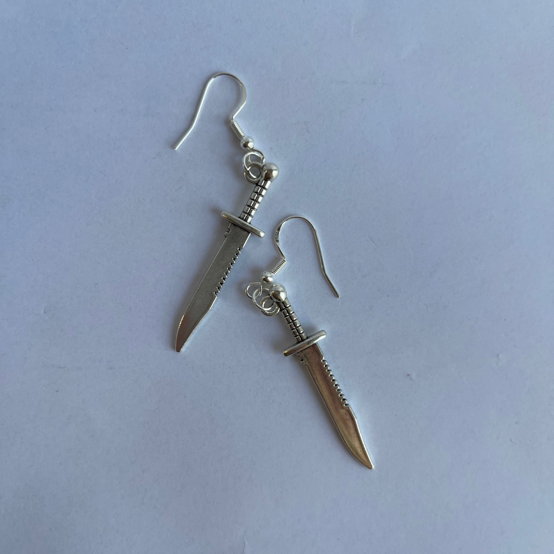 Tibetan silver dagger dangle earrings featuring antique finish and intricate blade detail