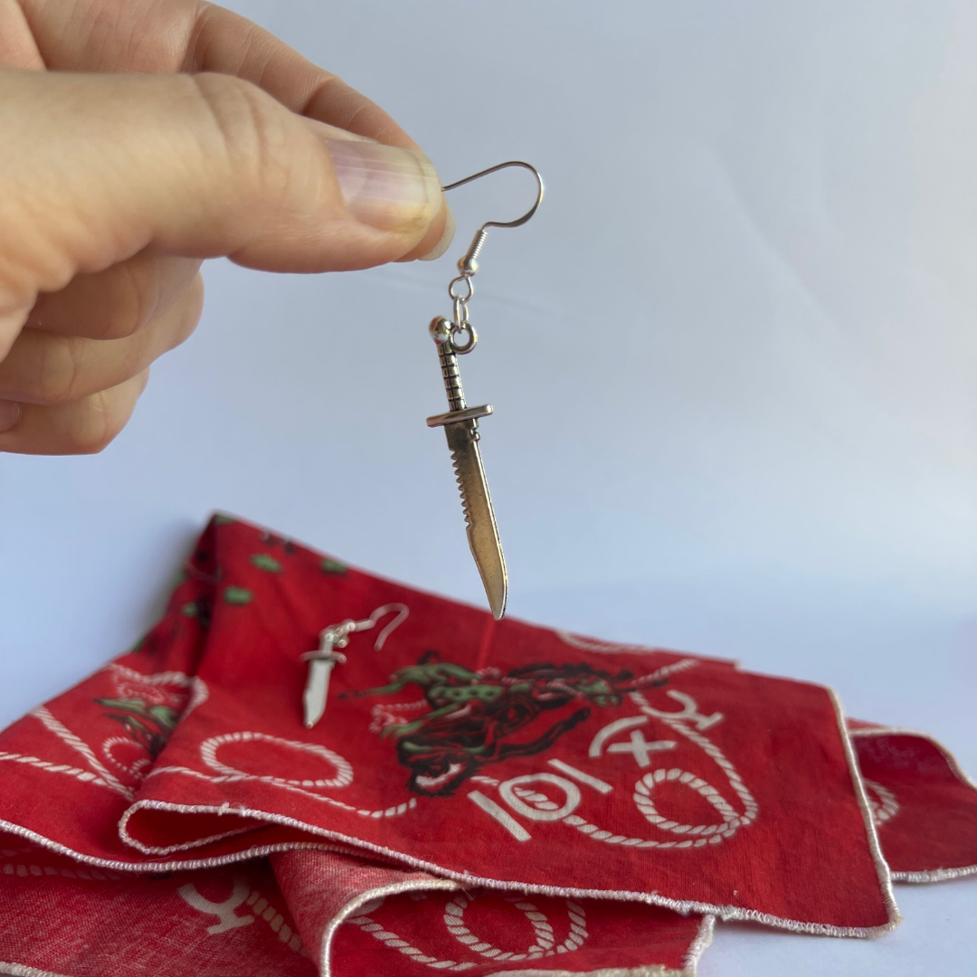 Tibetan silver dagger earrings displaying natural swing and movement