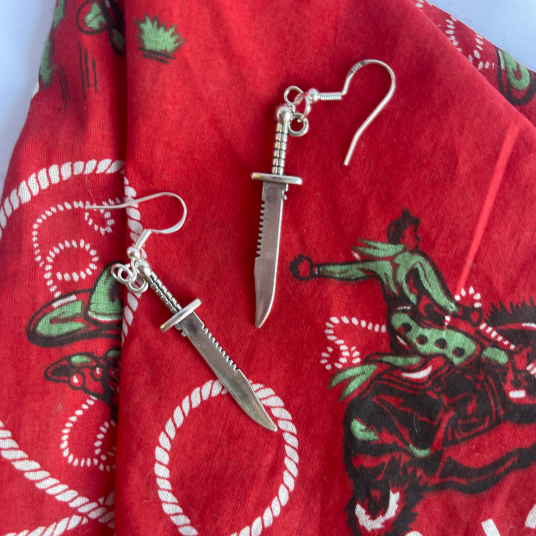 Knife / Dagger earrings styled with western and gothic fashion accessories