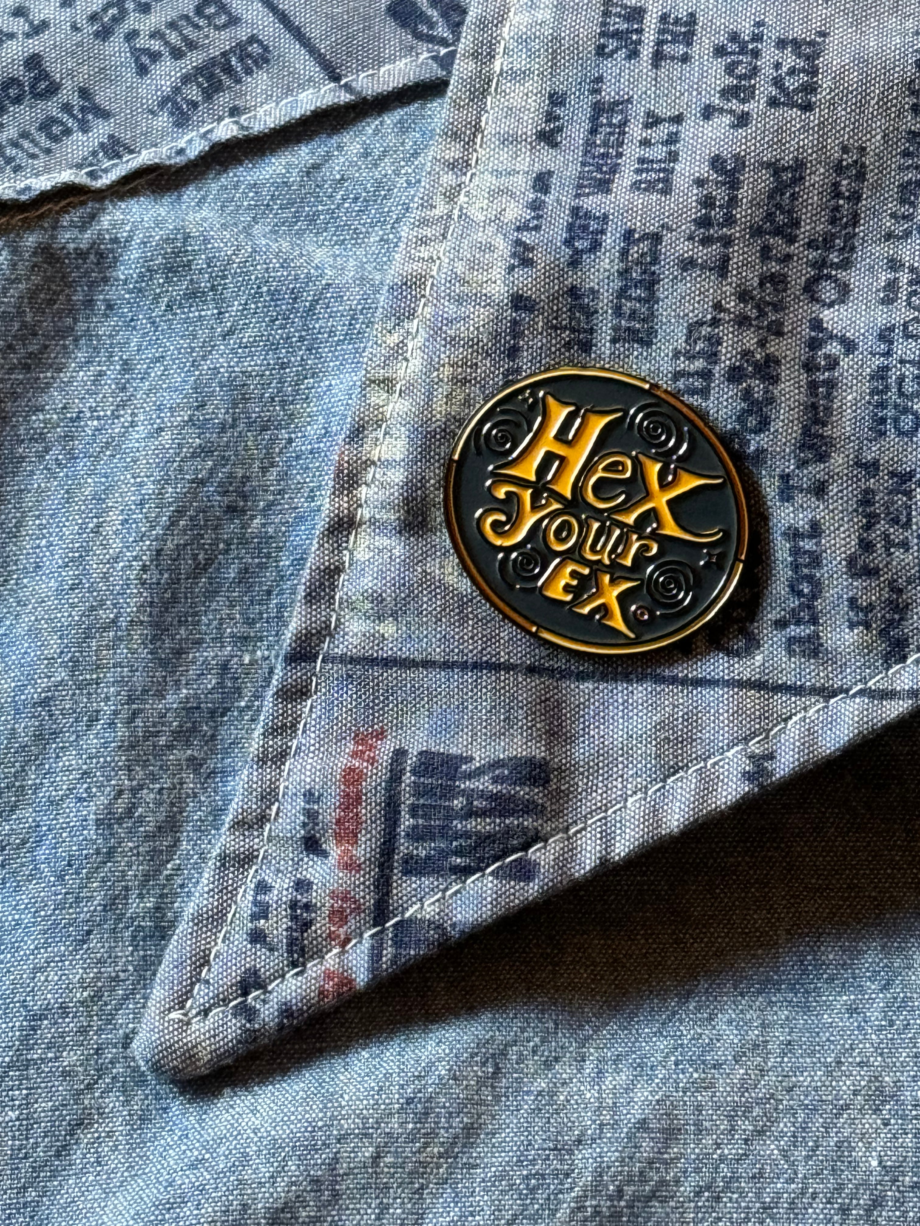 1.25-inch Hex Your Ex gothic pin displayed on black denim shirt