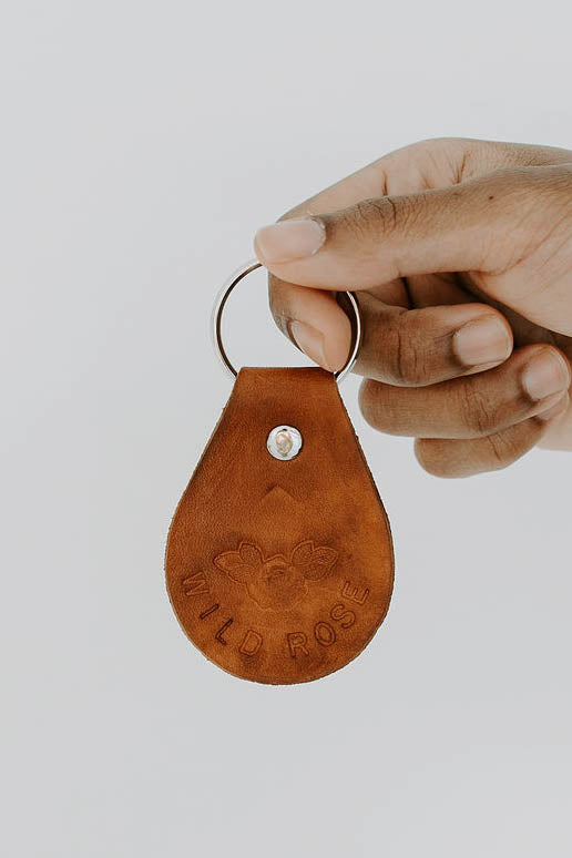 Wild rose design leather keychain featuring floral western artwork